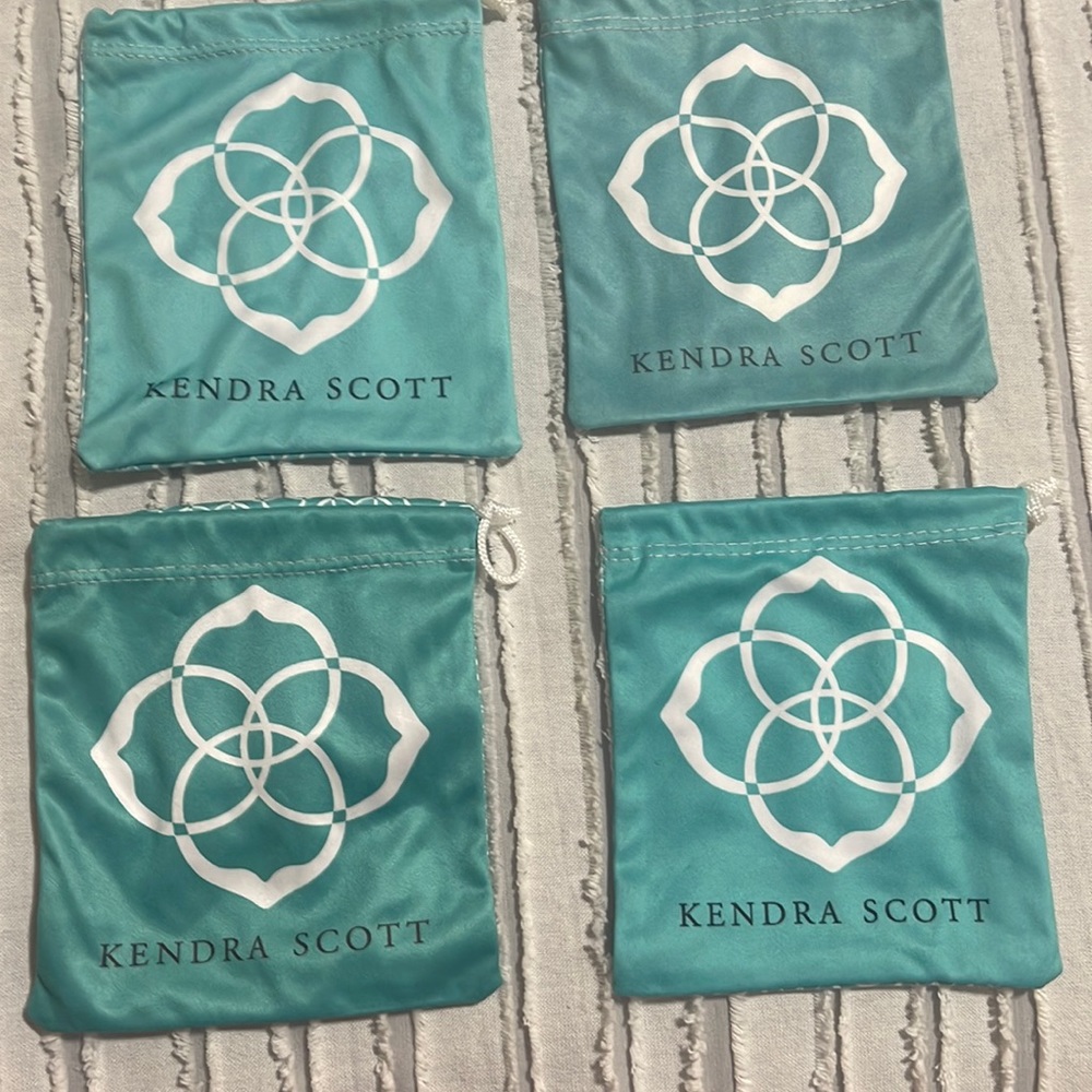 Four Kendra Scott jewlery bags